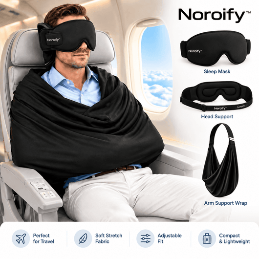 Man wearing black sleep mask with eye contour coverage on airplane seat, demonstrating travel sleep aid for comfort
